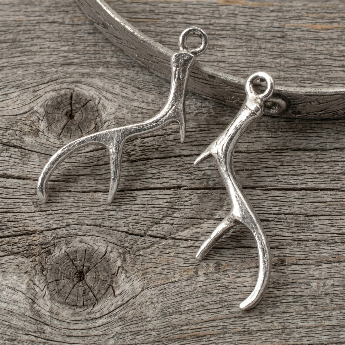 Hackberry Creek antique silver antler charms for jewelry making, featuring detailed pewter design in a 2-pack set.