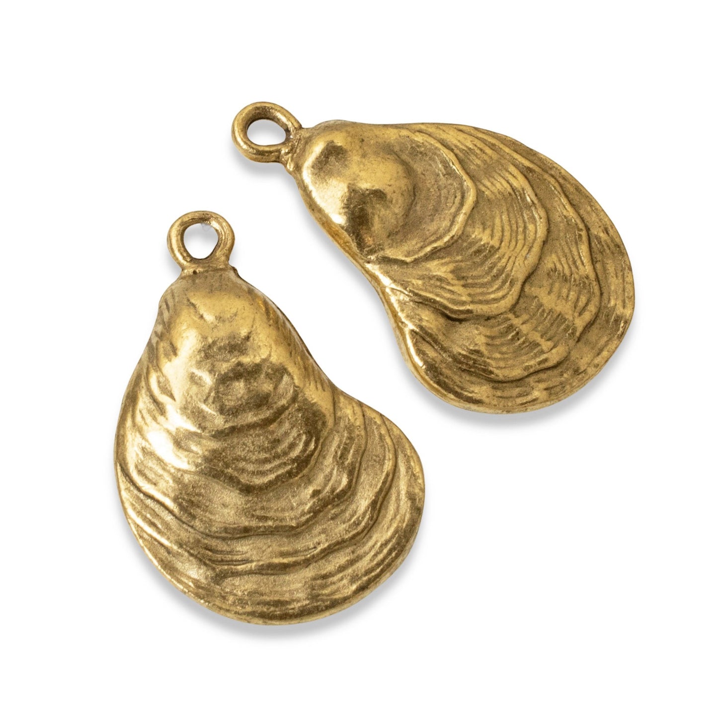 Hackberry Creek set of two 24k gold plated oyster shell charms with an antiqued finish for coastal jewelry making.