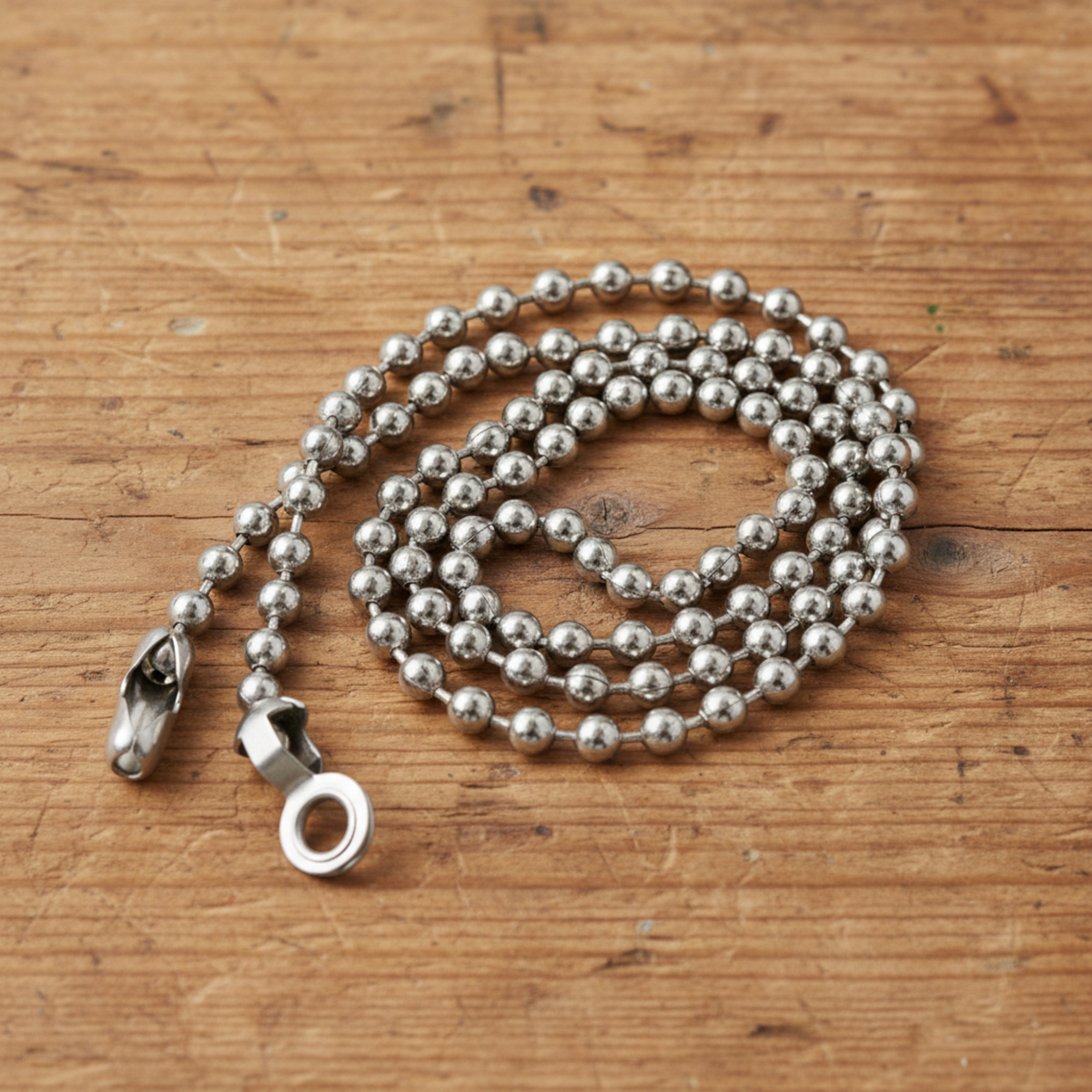 Hackberry Creek nickel-plated steel ball chain for DIY ceiling fan pulls with connectors on a rustic wood surface