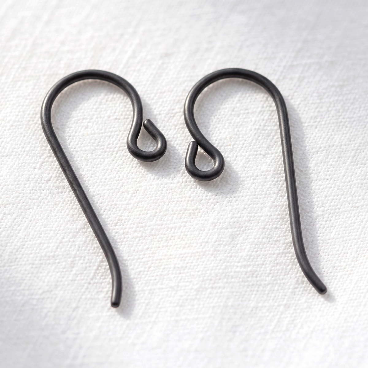 Hackberry Creek black niobium hypoallergenic French hook ear wires with small loops for minimalist jewelry designs.