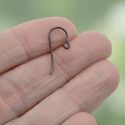 Hackberry Creek black niobium hypoallergenic French hook ear wire with small loop held in a hand