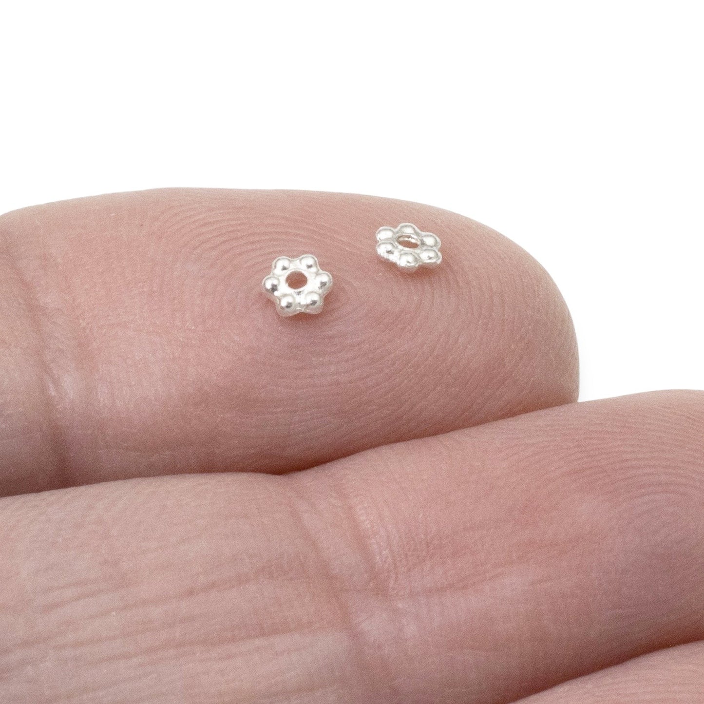 Hackberry Creek 3mm bright silver plated pewter daisy spacer beads, 500 count. Tiny floral heishi beads for jewelry making.