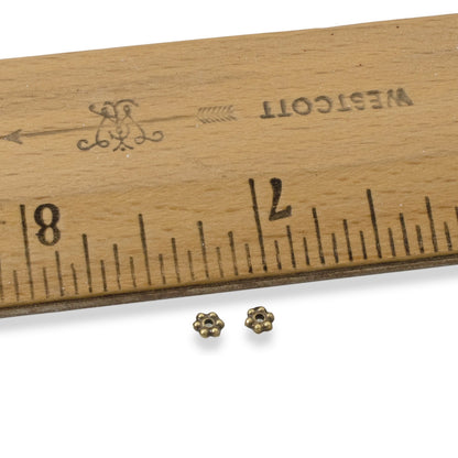Hackberry Creek 50 antique brass 3mm daisy spacer beads, made from lead-free pewter with a rich patina. Designed by TierraCast.
