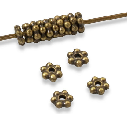 Hackberry Creek 50 antique brass 3mm daisy spacer beads made from lead-free pewter. Tiny jewelry beads with a .5mm hole.