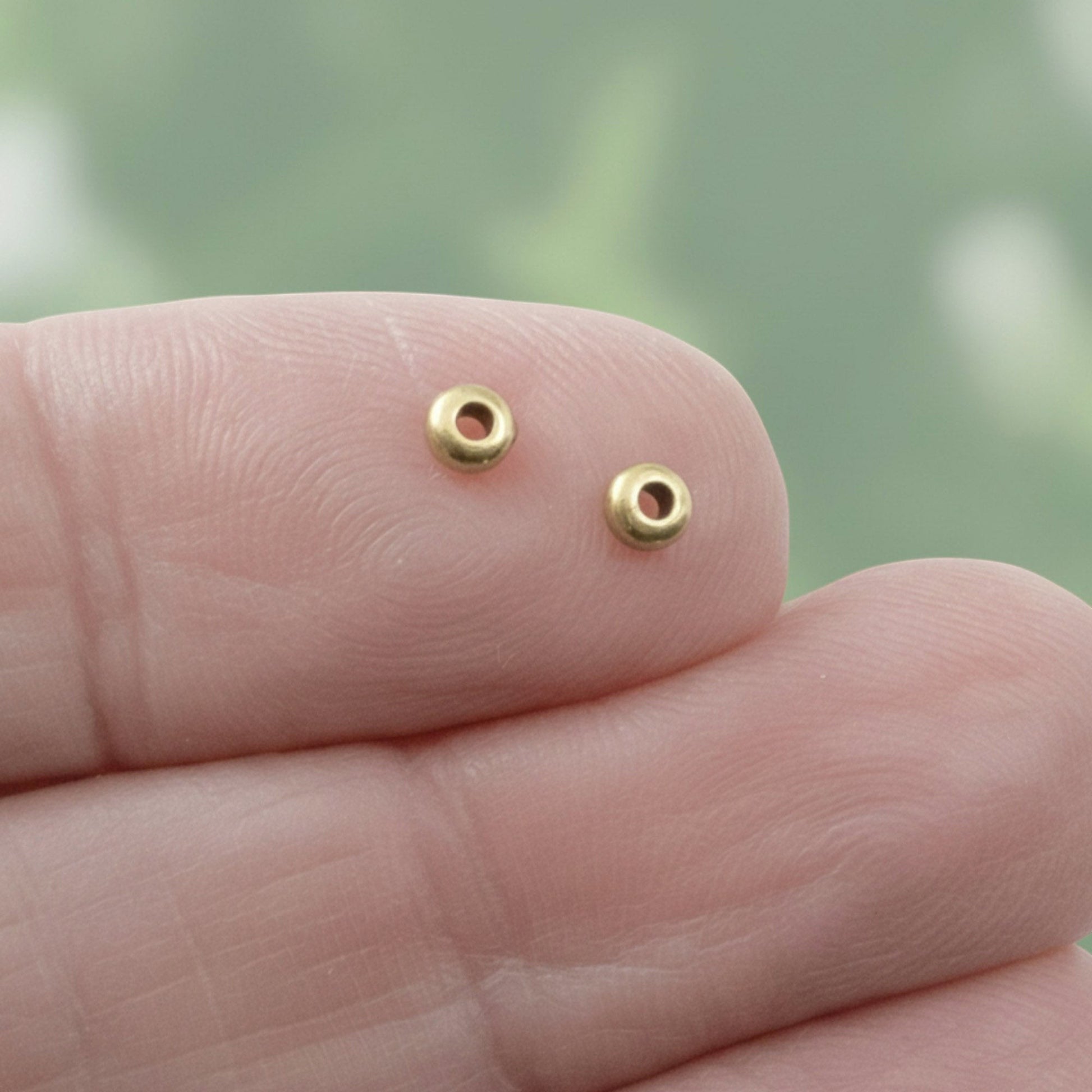 Hackberry Creek Antique Brass 3mm smooth disk heishi spacer beads for boho jewelry designs.