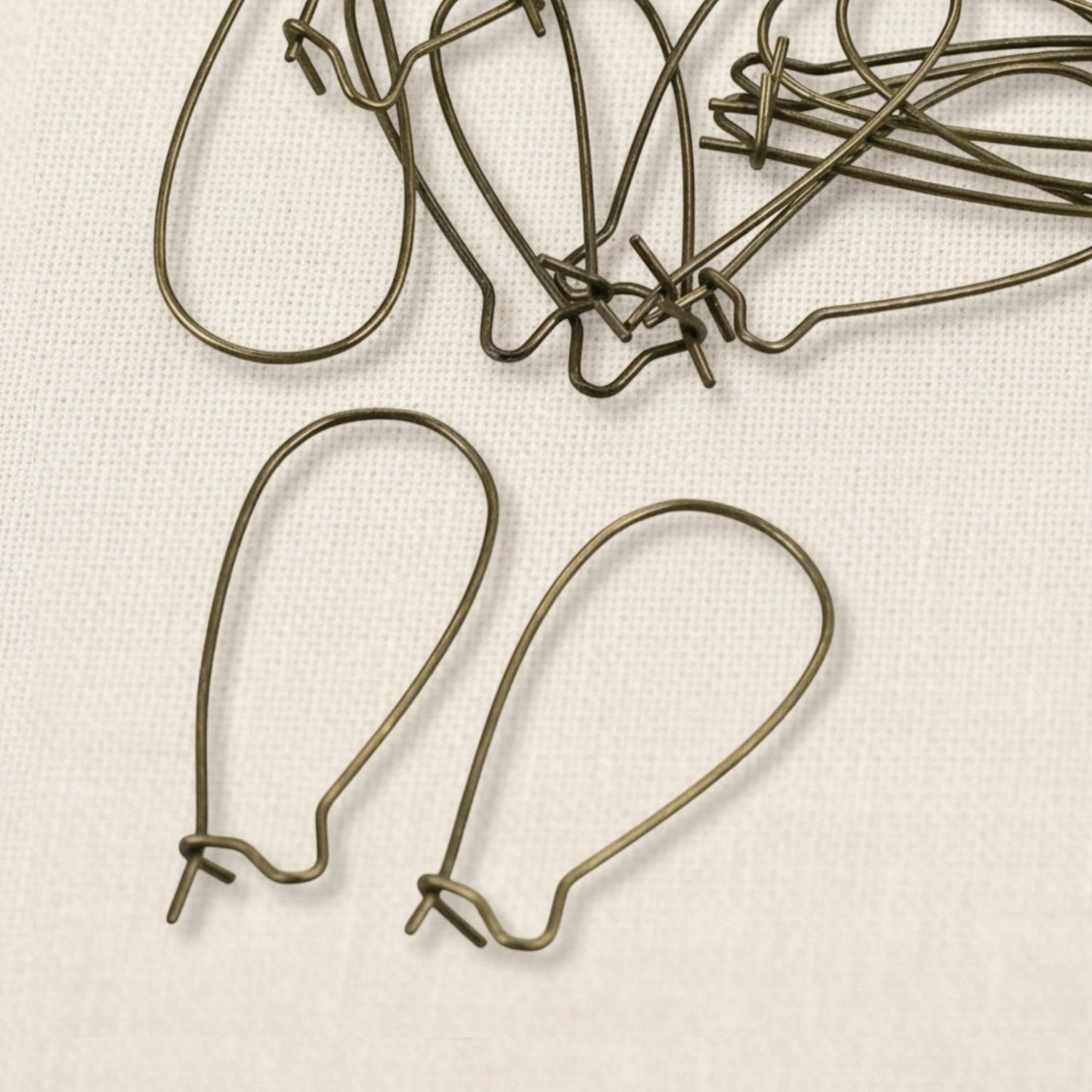 Hackberry Creek antique brass kidney ear wires, 33mm vintage boho earring findings with safety hook closure. 50 pieces.