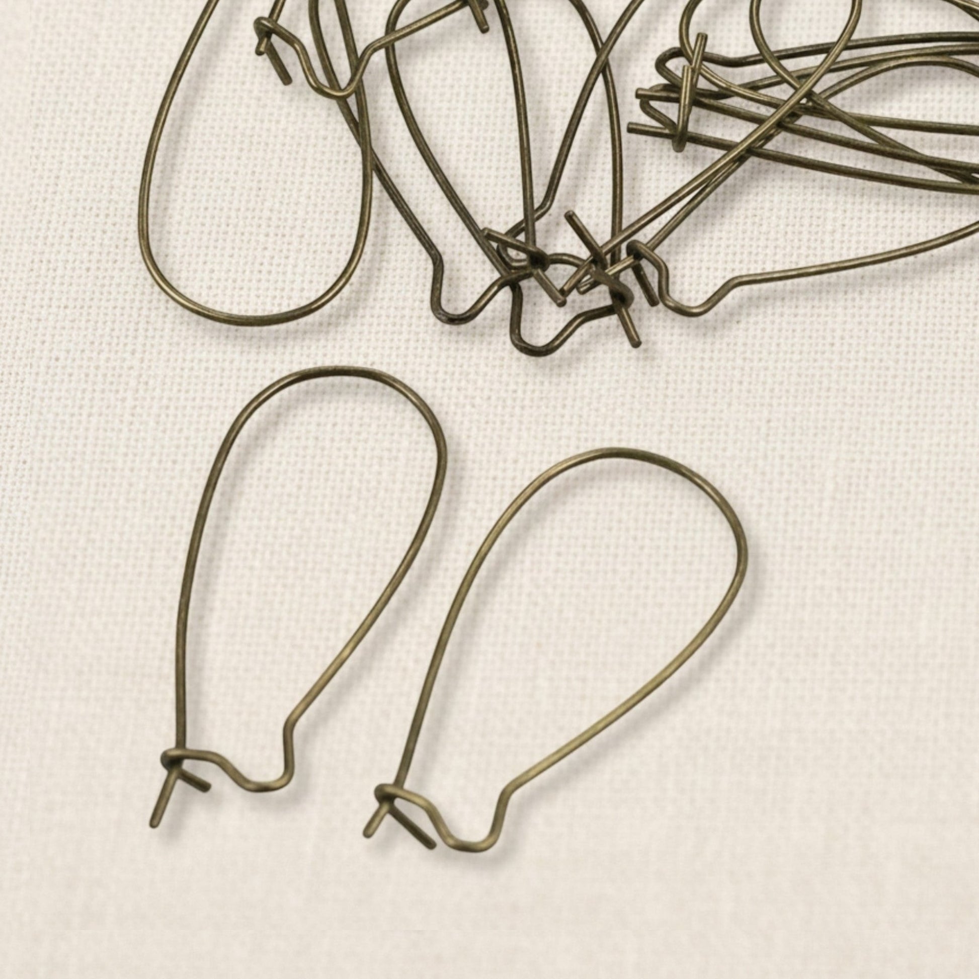Hackberry Creek antique brass kidney ear wires, 33mm vintage boho earring findings with safety hook closure. 50 pieces.