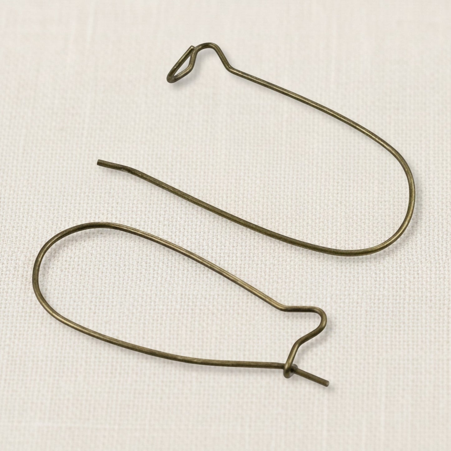 Hackberry Creek antique brass kidney ear wires, 33mm vintage boho earring findings with safety hook closure.
