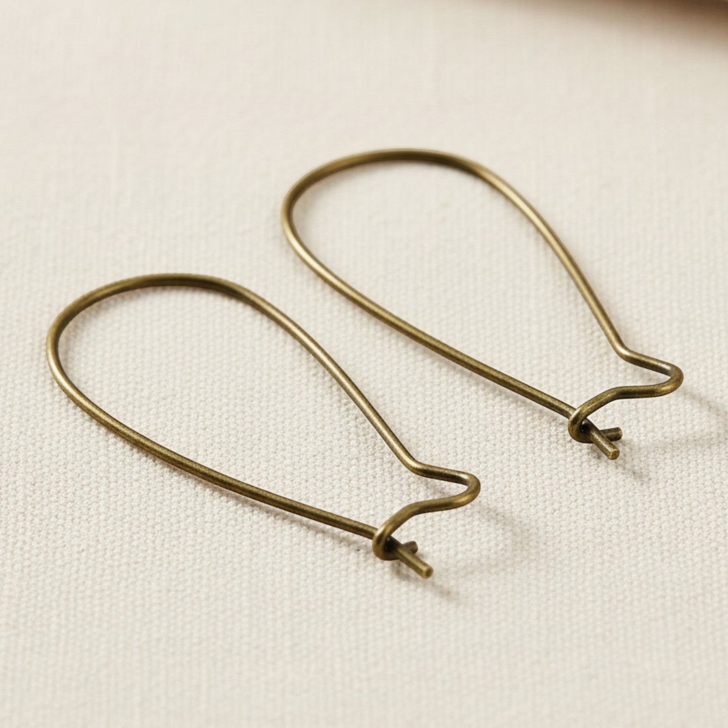 Hackberry Creek antique brass kidney ear wires, 33mm vintage boho earring findings with safety hook closure.