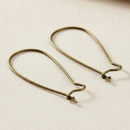 Hackberry Creek antique brass kidney ear wires, 33mm vintage boho earring findings with safety hook closure.