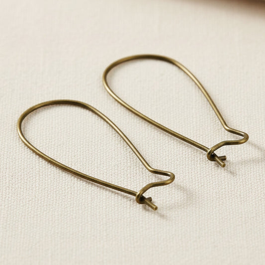 Hackberry Creek antique brass kidney ear wires, 33mm vintage boho earring findings with safety hook closure.
