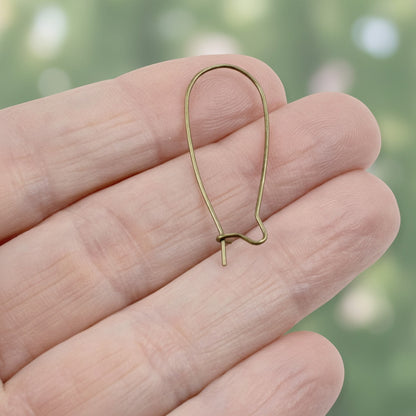 Hackberry Creek antique brass kidney ear wires, 33mm vintage boho earring findings with safety hook closure.