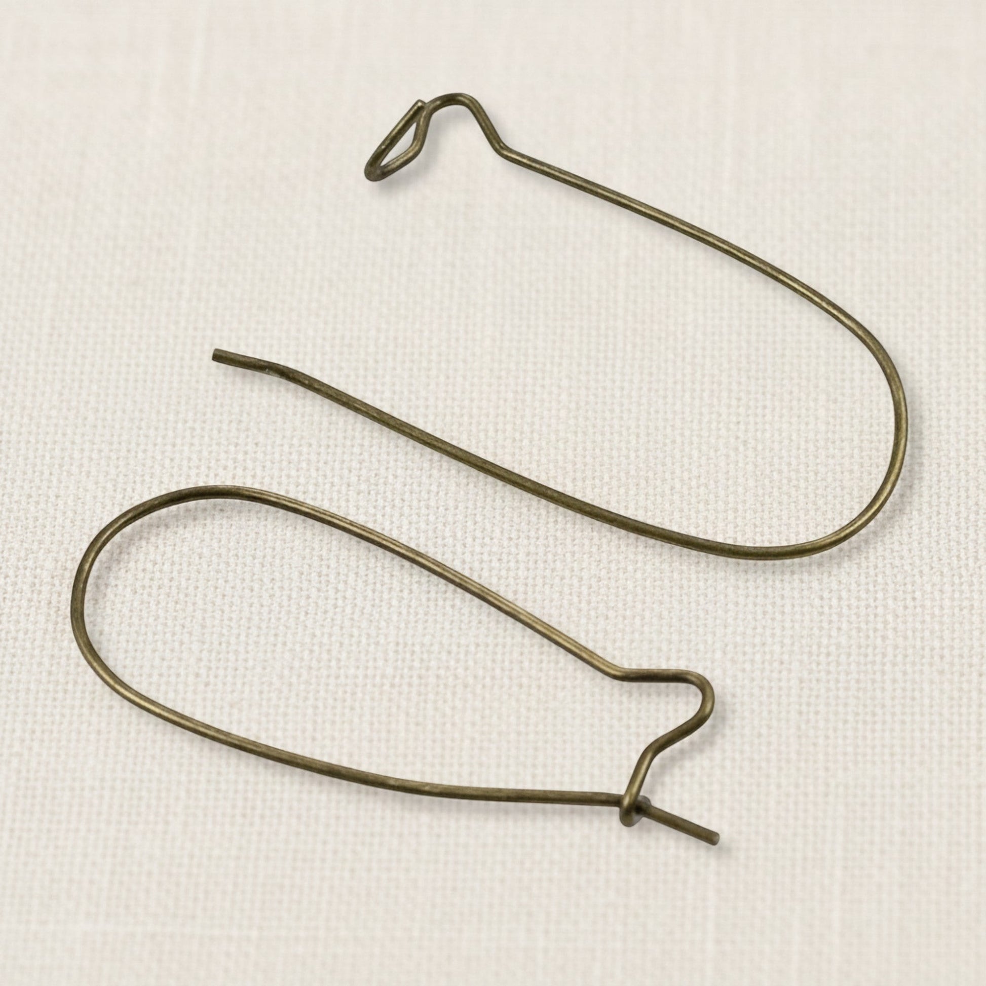 Hackberry Creek antique brass kidney ear wires, 33mm vintage boho earring findings with safety hook closure. 50 pieces.