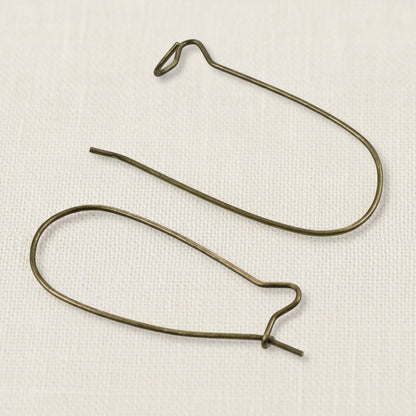 Hackberry Creek antique brass kidney ear wires, 33mm vintage boho earring findings with safety hook closure. 50 pieces.