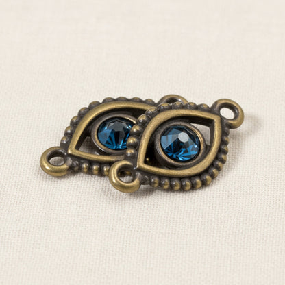 Hackberry Creek antique brass evil eye connector links with blue crystal accents for DIY jewelry making