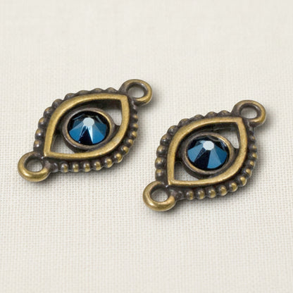 Hackberry Creek antique brass evil eye connector links with blue crystal centers for bohemian jewelry making