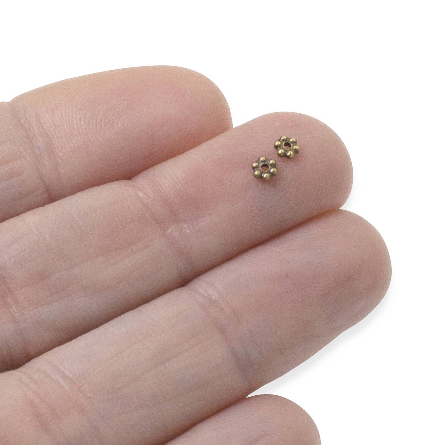 Hackberry Creek Antique Brass 3mm daisy spacer beads, made from lead-free pewter. Tiny heishi beads for jewelry making.