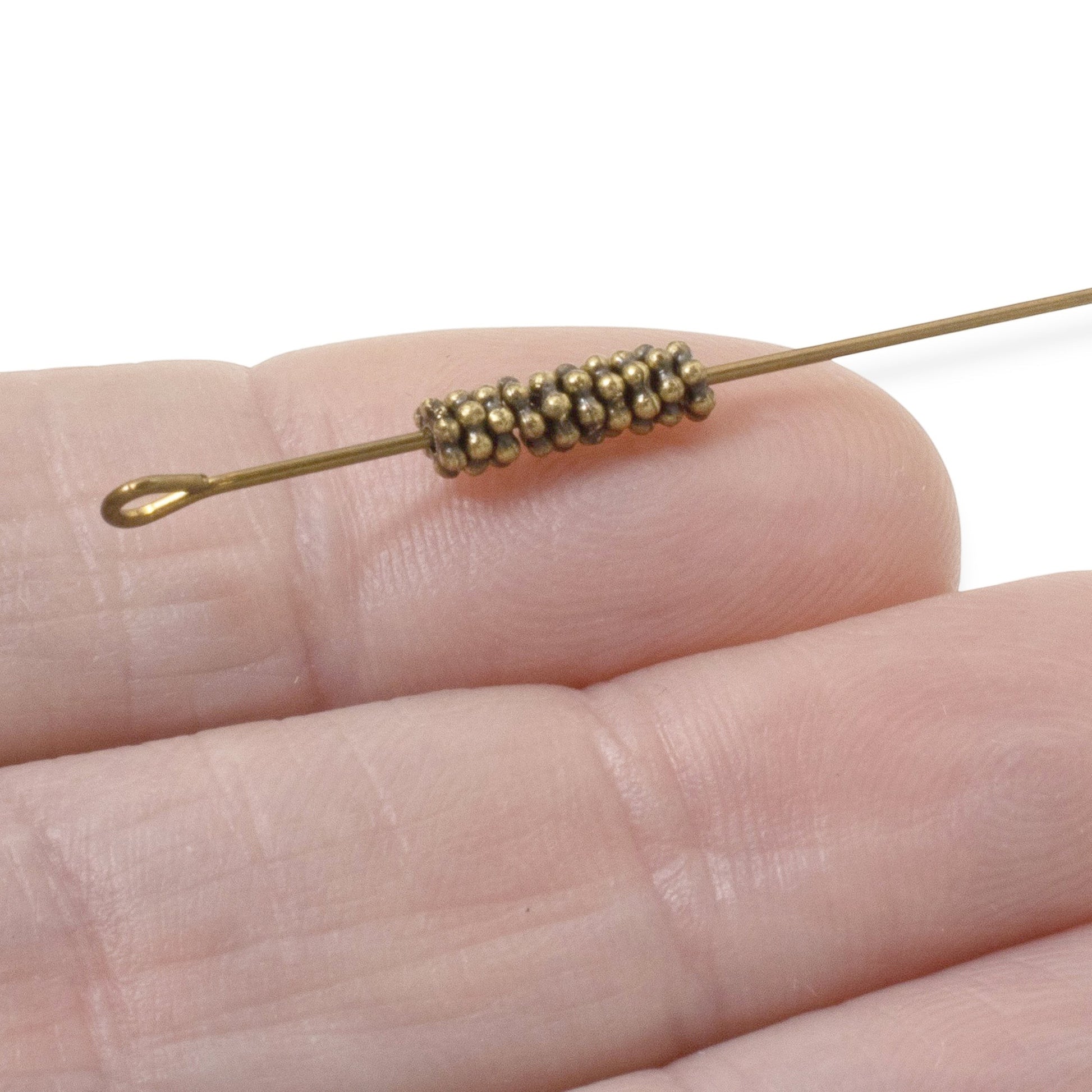 Hackberry Creek 50 antique brass 3mm daisy spacer beads made of lead-free pewter. Tiny jewelry beads for DIY crafts.