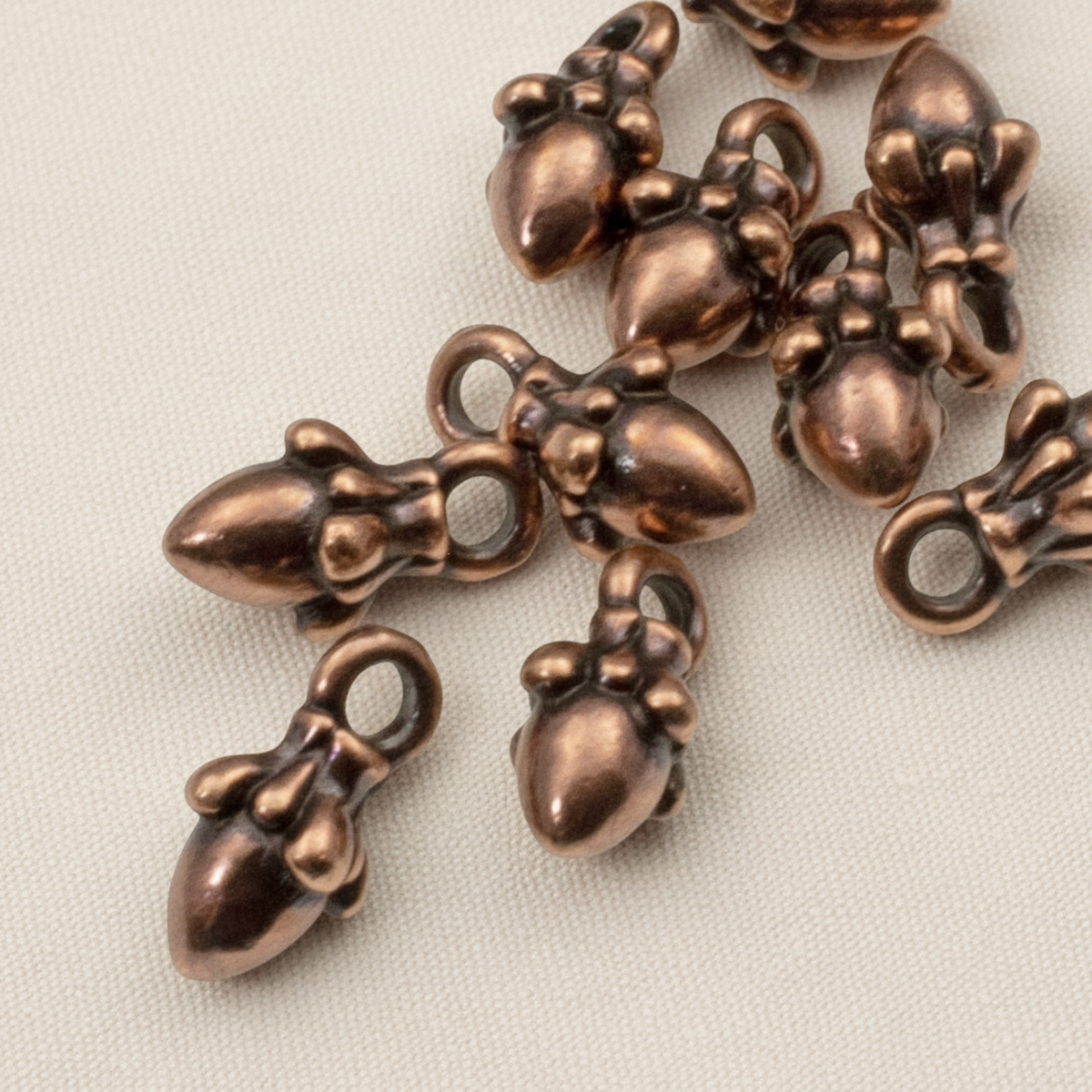 Hackberry Creek antique copper acorn charms with 3D sculpted detail for leather cord jewelry making