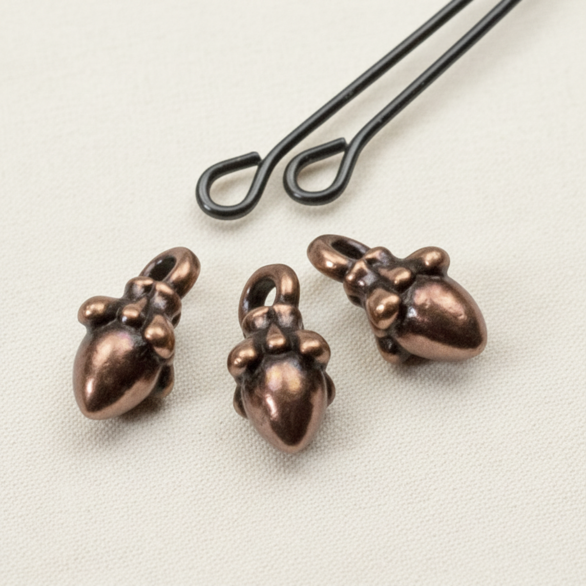 Hackberry Creek antique copper acorn charms with 3D sculpted detail for leather cord jewelry making