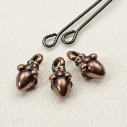Hackberry Creek antique copper acorn charms with 3D sculpted detail for leather cord jewelry making