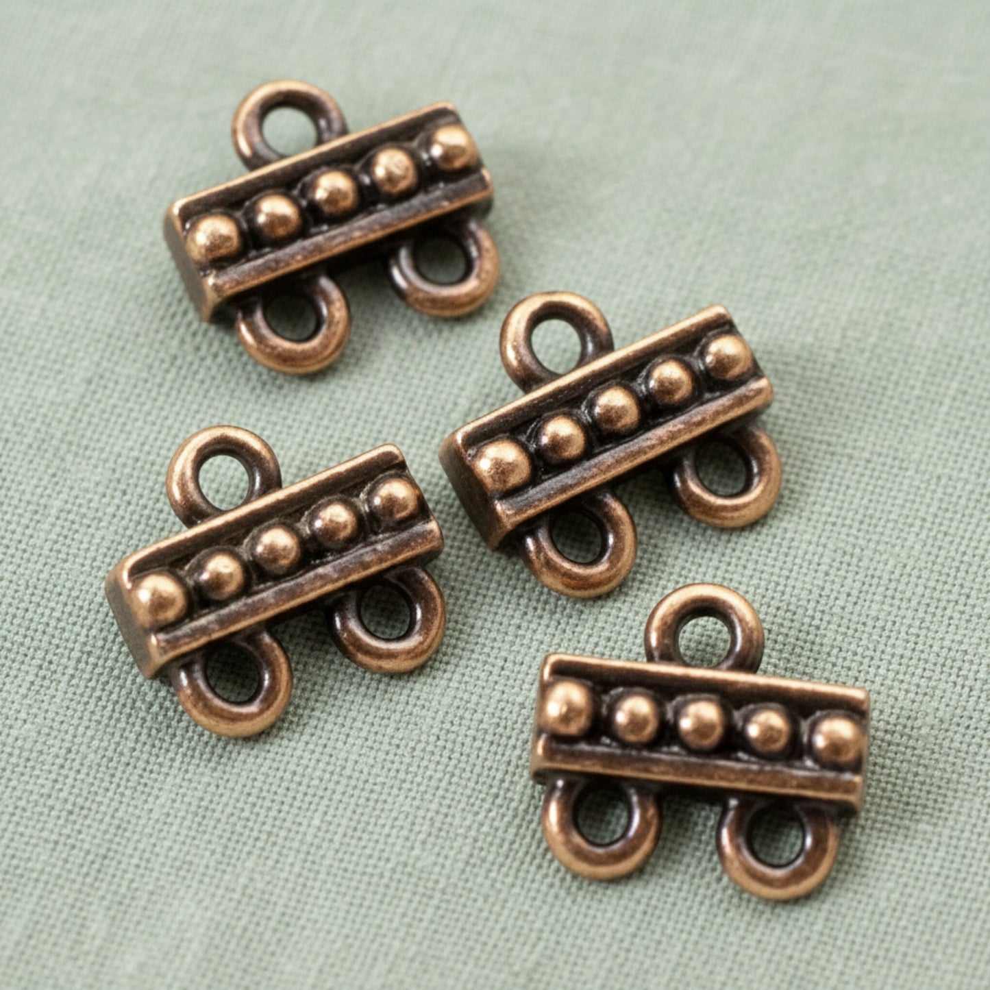 Hackberry Creek antique copper 2:1 beaded jewelry connectors made of lead-free pewter for multi-strand designs.
