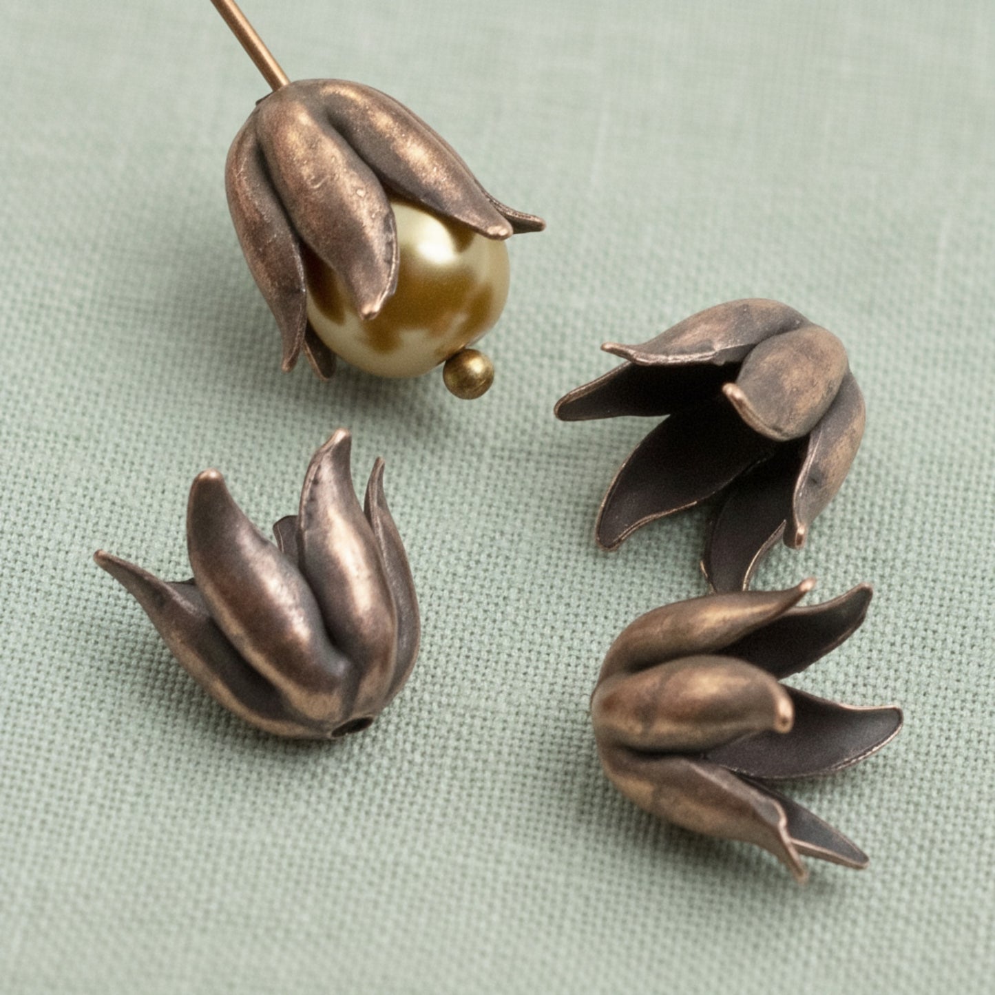Hackberry Creek antique copper-plated pewter bead caps with a sculptural curled petal design for 8mm beads.