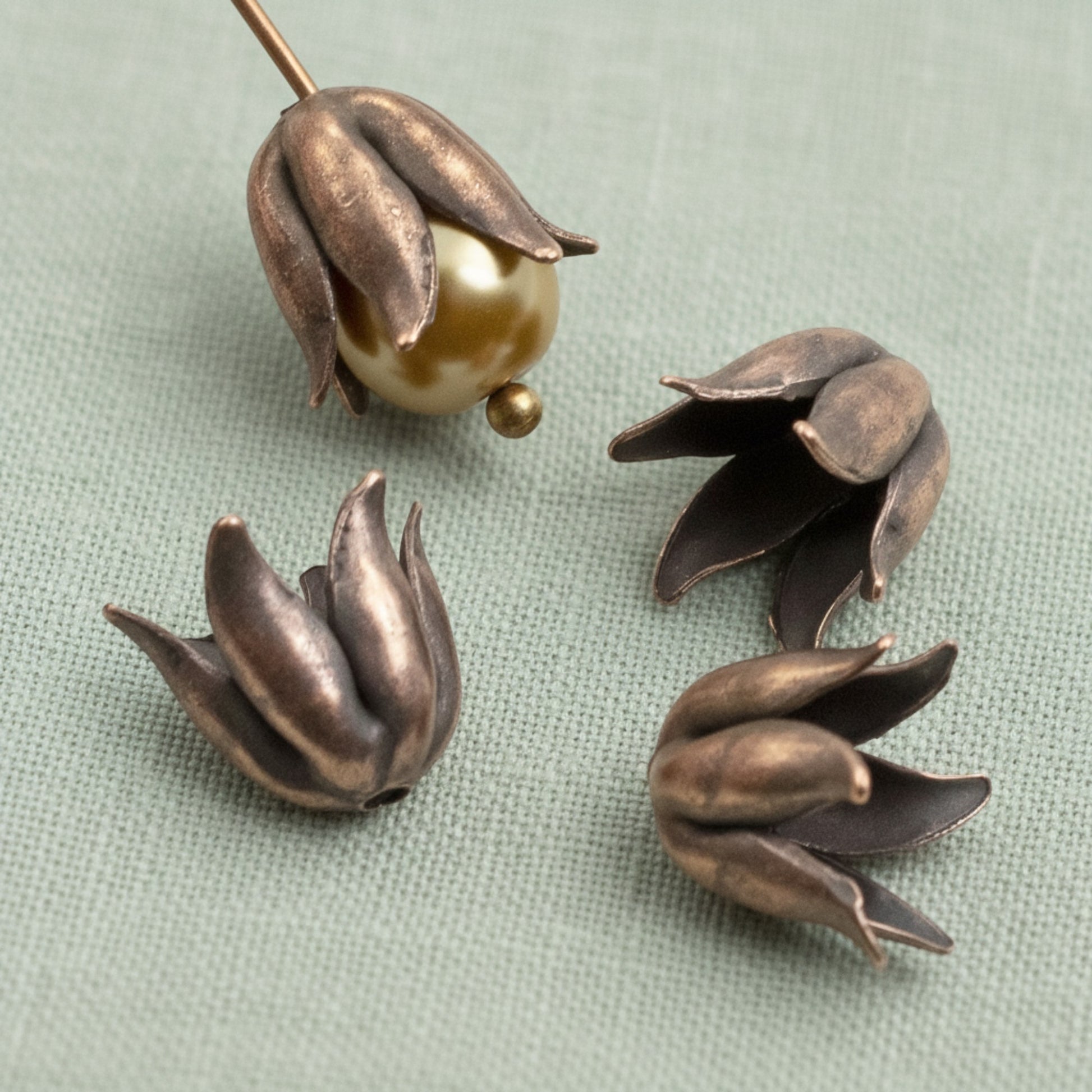 Hackberry Creek antique copper-plated pewter bead caps with a sculptural curled petal design for 8mm beads.