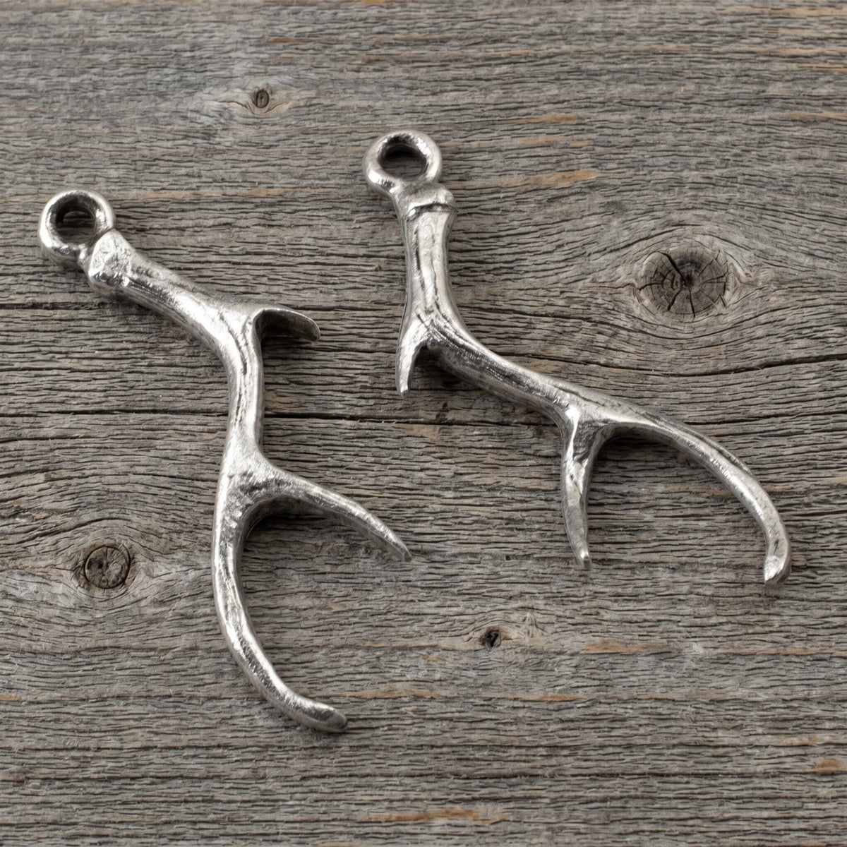 Hackberry Creek antique silver antler charms for jewelry making, featuring detailed pewter design in a 2-pack.