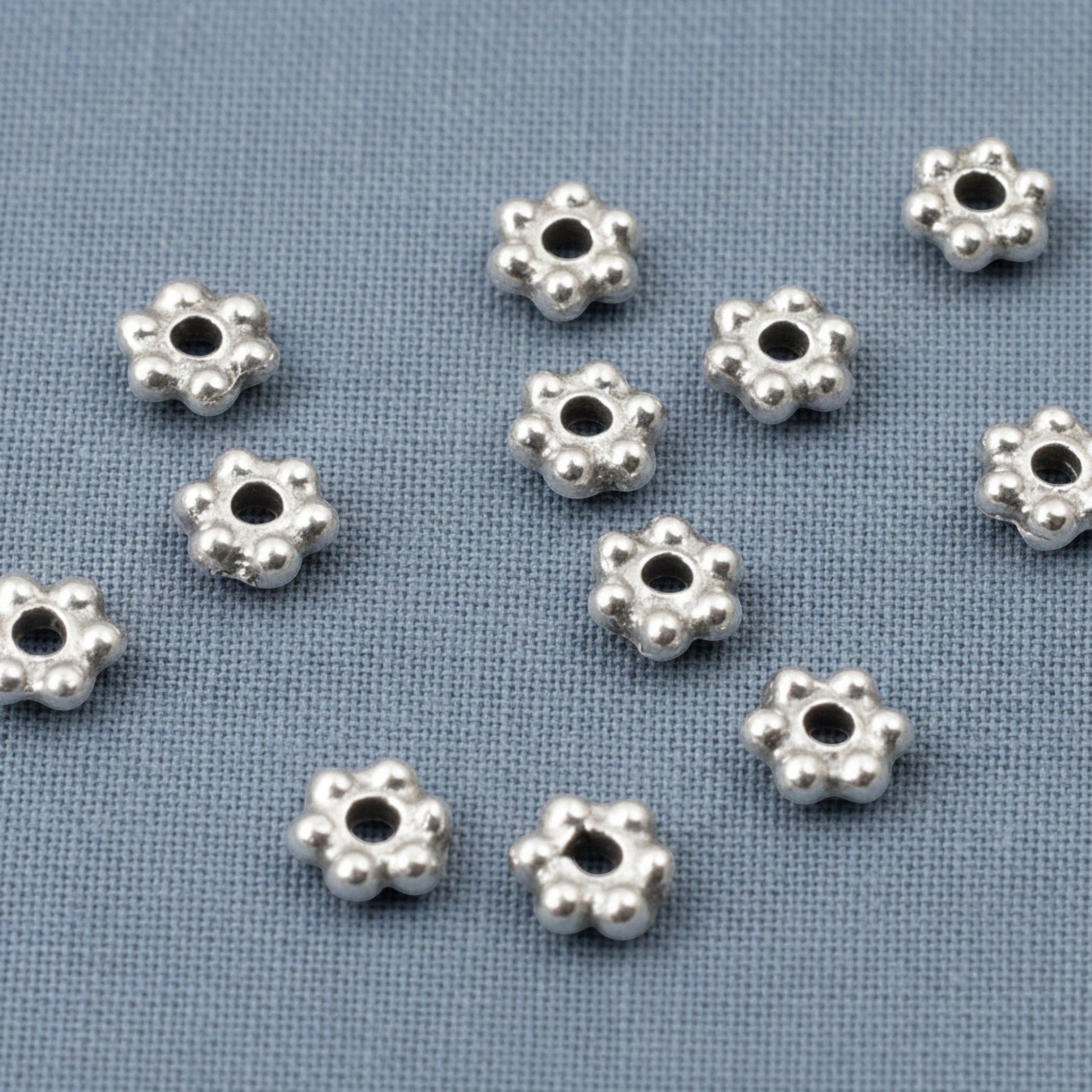 Hackberry Creek antique silver 3mm daisy spacer beads with oxidized finish, 500 bulk pack, pewter with silver plating.