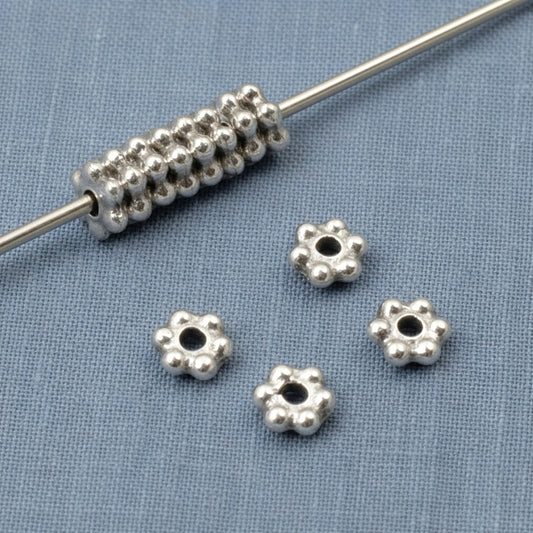 Hackberry Creek antique silver 3mm daisy spacer beads with oxidized finish, perfect for jewelry making.