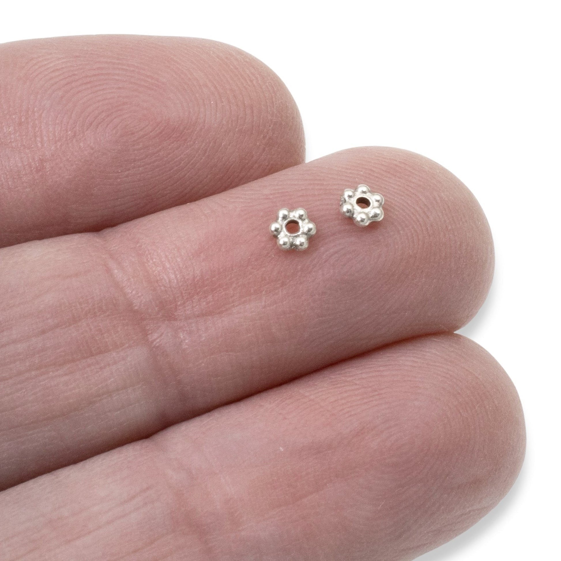 Hackberry Creek antique silver 3mm daisy spacer beads with oxidized finish, perfect for jewelry making.