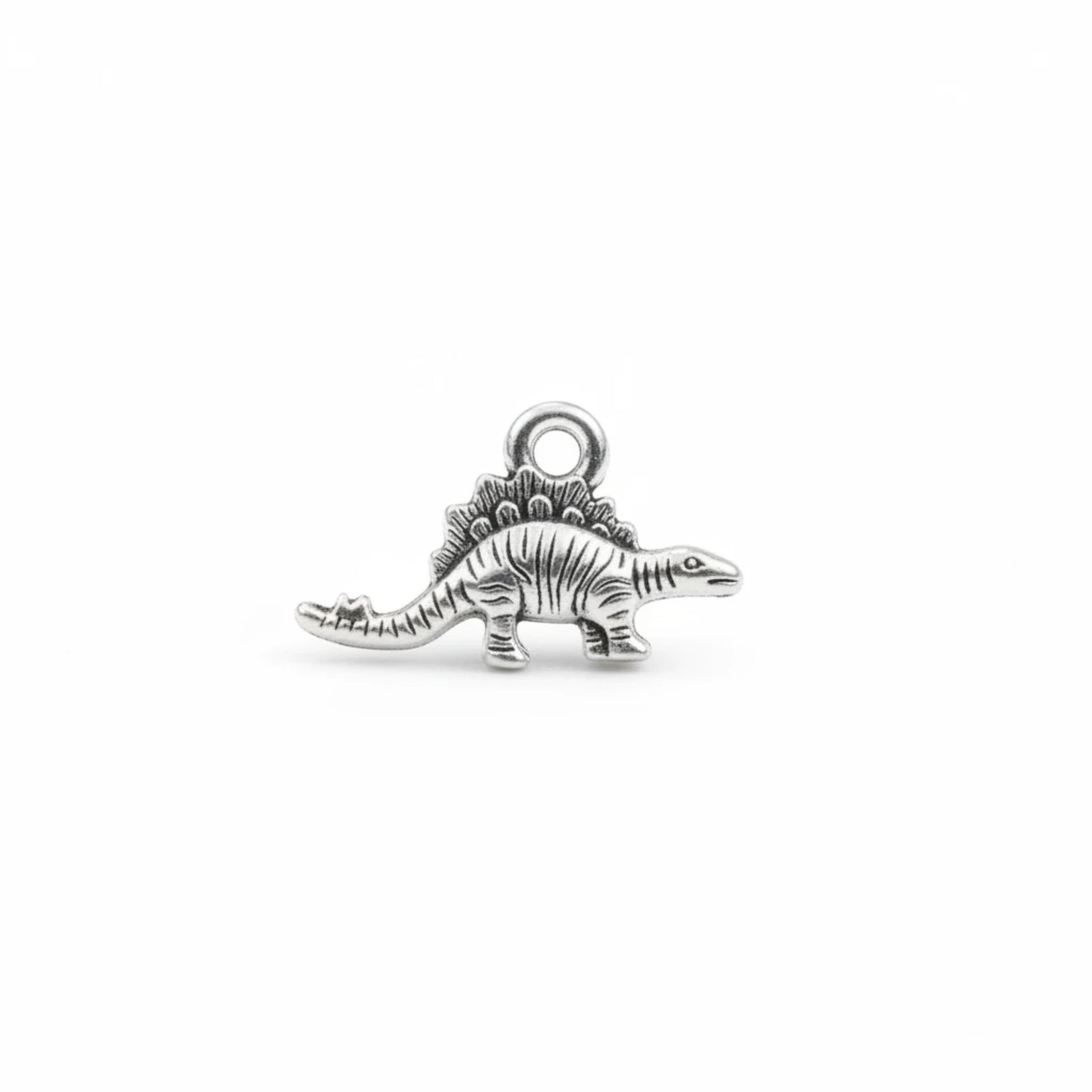 Hackberry Creek antique silver dinosaur charm for jewelry making with detailed prehistoric stegosaurus design