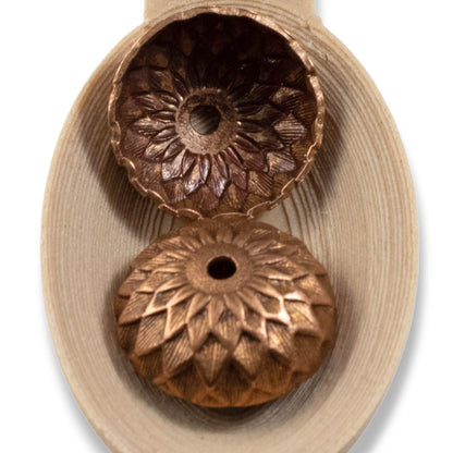 Hackberry Creek artisan copper acorn bead caps with a detailed sunflower and petal relief design in a 12.5mm size.