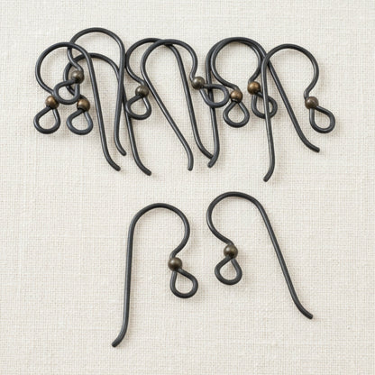 Hackberry Creek matte black niobium earring hooks with antique brass bead, 10 pack. Hypoallergenic for sensitive ears.