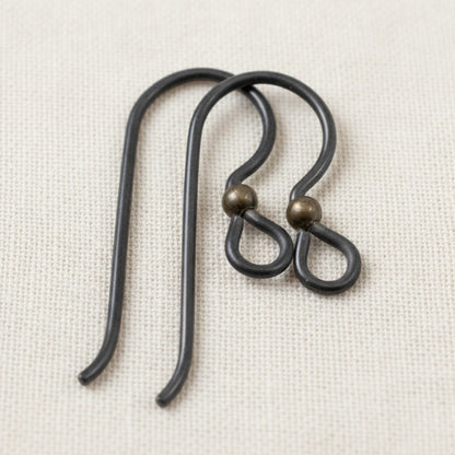 Hackberry Creek matte black niobium earring hooks with antique brass bead, 10 pack, for sensitive ears and vintage boho styles.