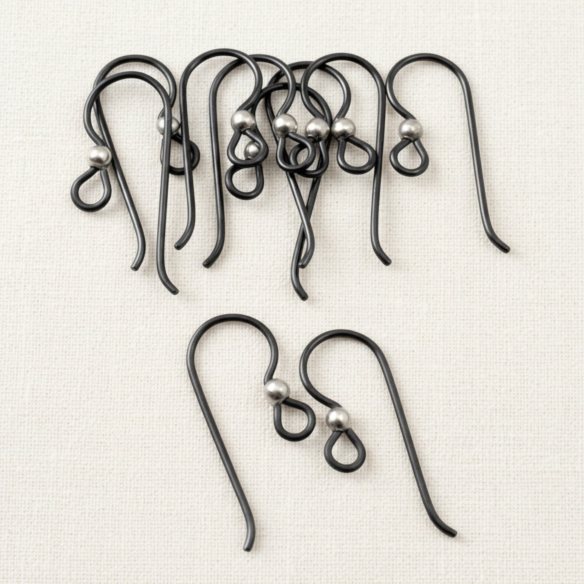 Hackberry Creek matte black niobium earring hooks with sterling silver bead, hypoallergenic findings for sensitive ears, 10-pack.