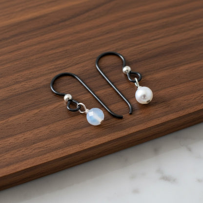 Hackberry Creek matte black niobium earring hooks with sterling silver bead and pearl or opal bead, hypoallergenic findings for sensitive ears.