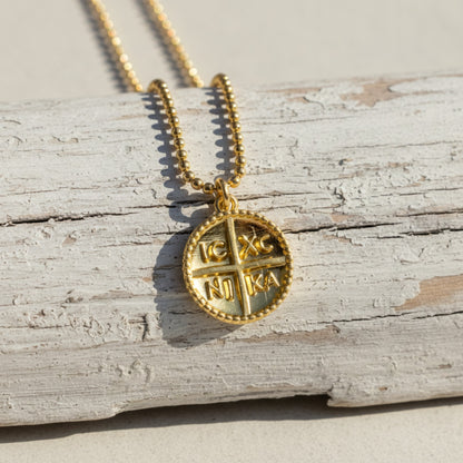 Hackberry Creek gold Byzantine cross pendant with IC XC NI KA inscription and beaded border. Charm size.