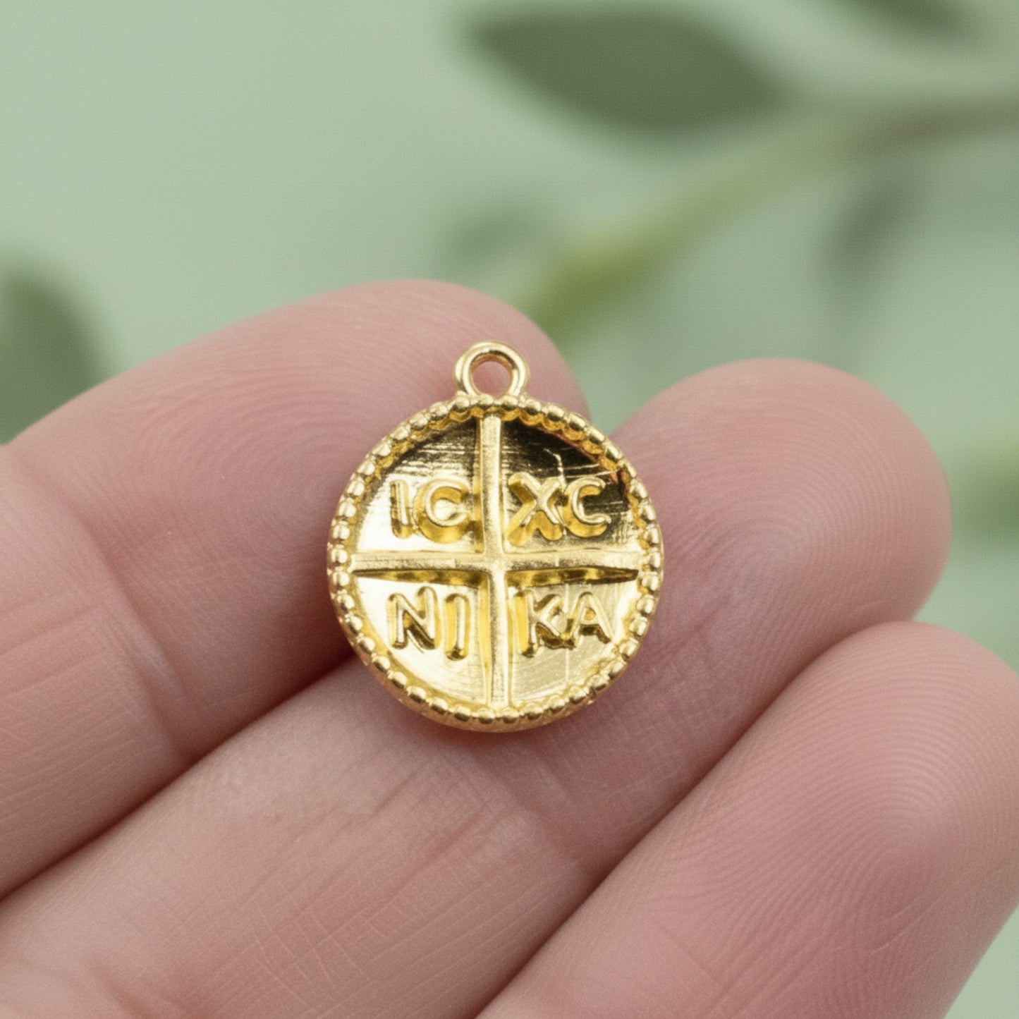 Hackberry Creek gold Byzantine cross pendant with IC XC NI KA inscription and beaded border. Charm size, 24K gold plated zamak.