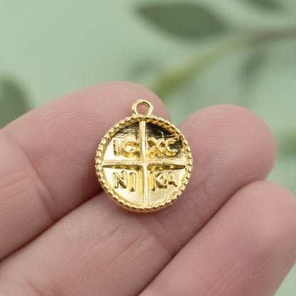 Hackberry Creek gold Byzantine cross pendant with IC XC NI KA inscription and beaded border. Charm size, 24K gold plated zamak.