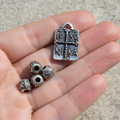 Hackberry Creek antique silver plated Byzantine cross pendant with IC XC NI KA inscription and four small decorative beads.