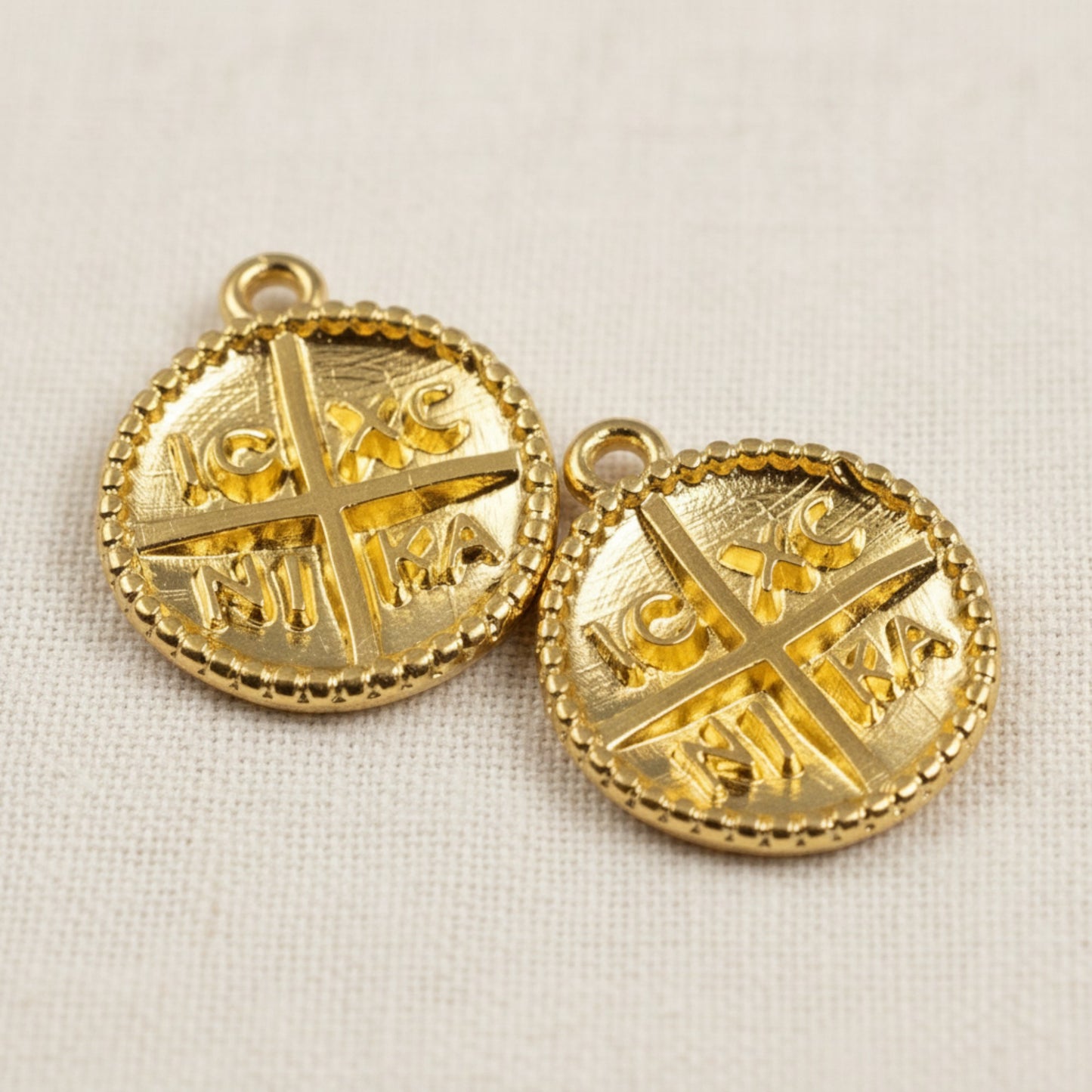 Hackberry Creek gold Byzantine cross pendants with IC XC NI KA inscription and beaded border. 24K gold plated zamak charms.