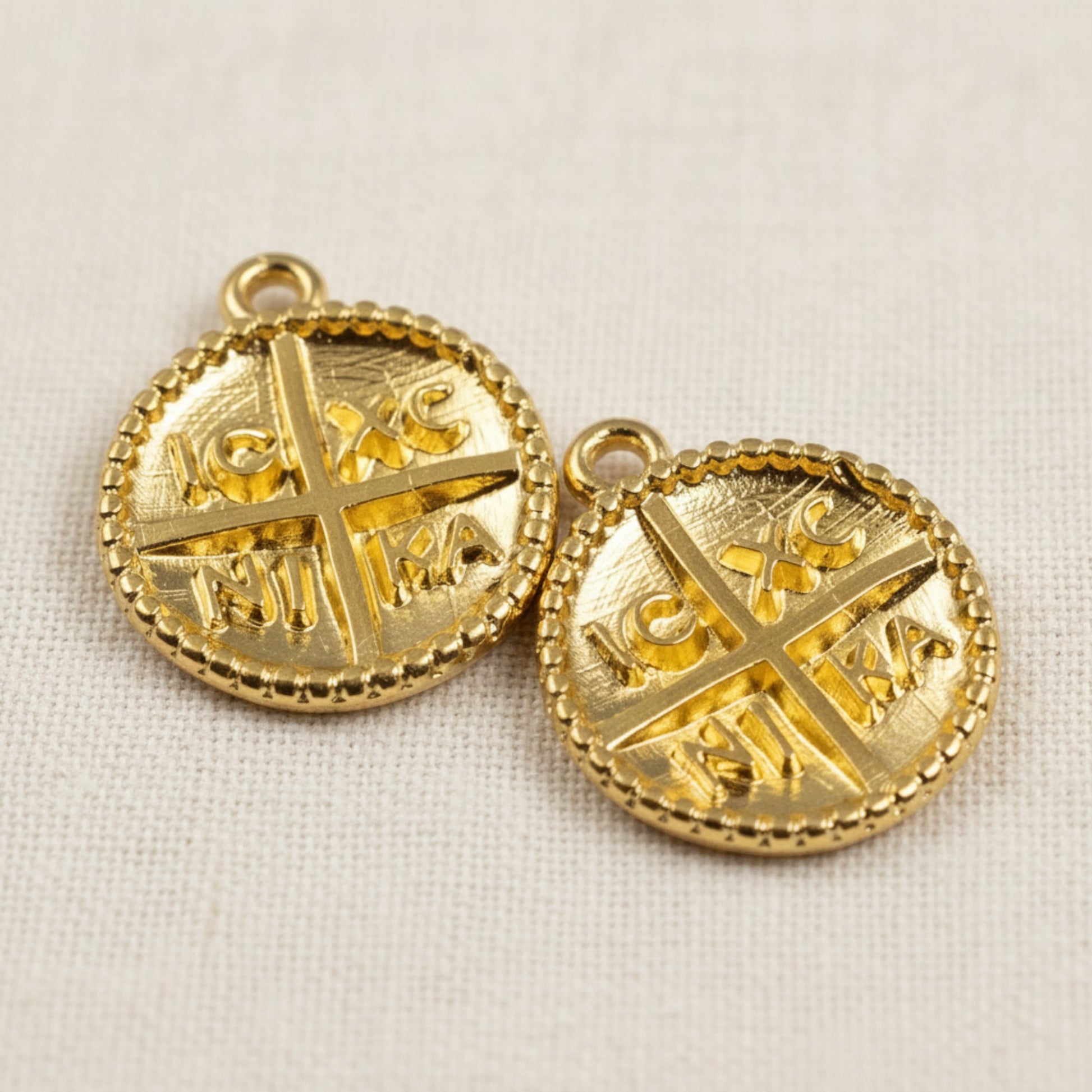 Hackberry Creek gold Byzantine cross pendants with IC XC NI KA inscription and beaded border. 24K gold plated zamak charms.