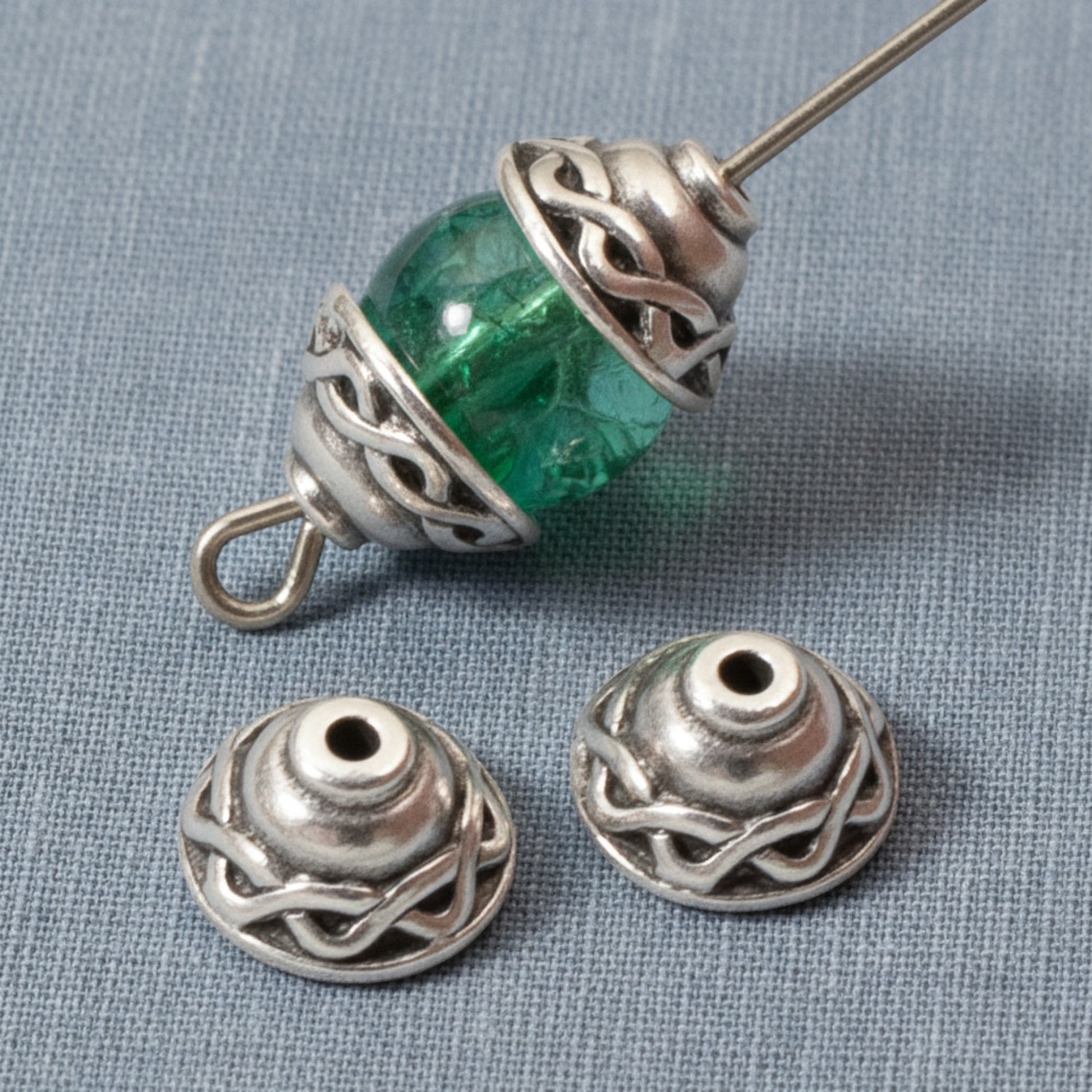 Hackberry Creek antique silver plated pewter Celtic braid motif bead caps, 4-pack. Detailed design perfect for jewelry making.