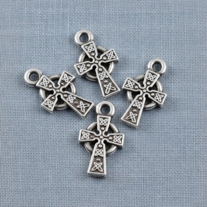 Hackberry Creek silver Celtic cross charms with detailed knotwork and antique finish, set of four for jewelry making.