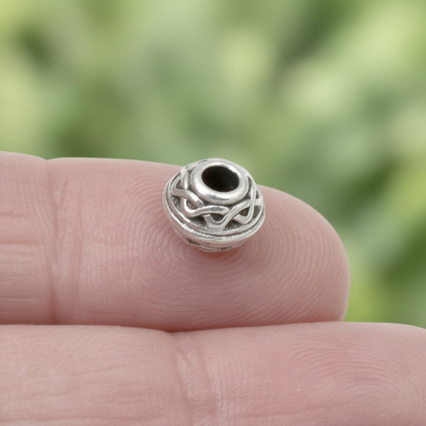 Hackberry Creek antique silver rondelle bead with Celtic rope pattern and 3mm hole for leather cord jewelry.