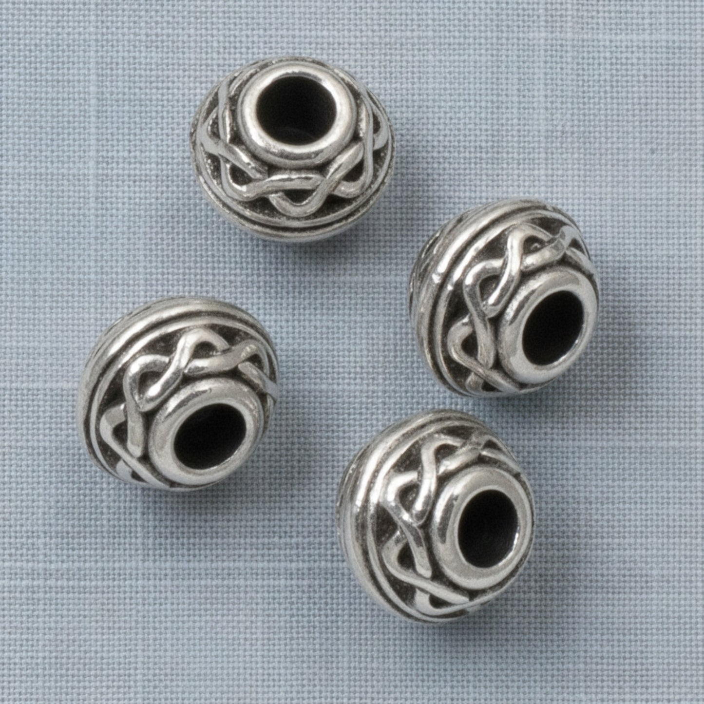Hackberry Creek antique silver Celtic rope pattern beads with 3mm large holes for leather cord jewelry making.