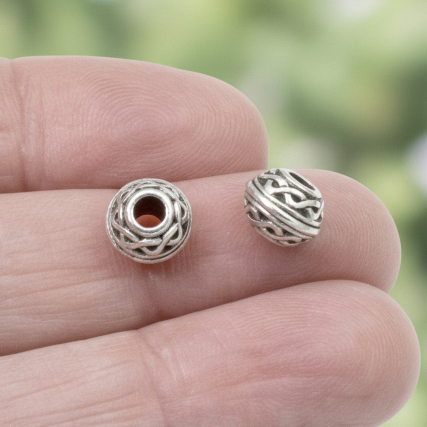 Hackberry Creek antique silver rondelle beads with Celtic rope pattern and 3mm hole for leather cord jewelry.