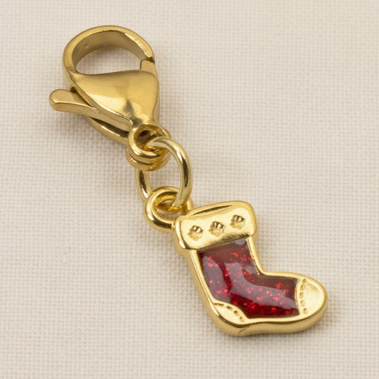 Hackberry Creek gold-plated Christmas stocking charm with red glitter enamel and a secure lobster clasp.